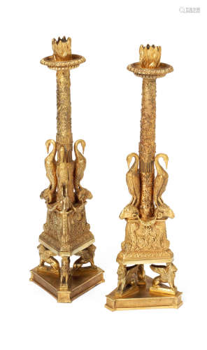 probaly Italian, the models after designs by Giovanni Battista Piranesi (Italian, 1720-1778) A pair of 19th century gilt bronze candlesticks