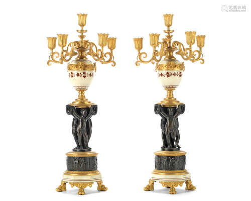 probably late 19th / early 20th century  A pair of French gilt and patinated bronze and painted marble six light figural candelabra