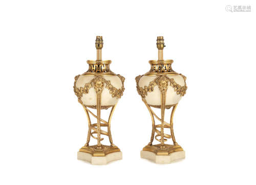 in the Louis XVI style A pair of early 20th century gilt bronze and white marble vase lampbases