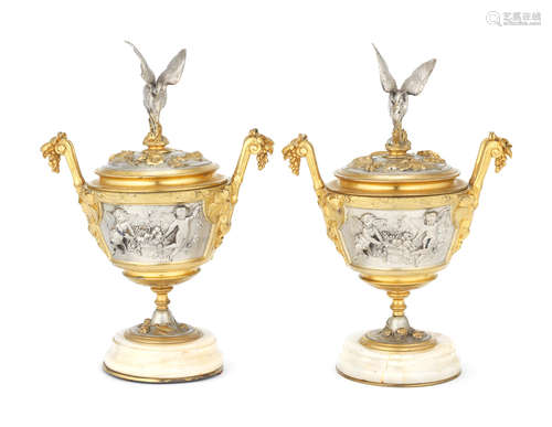 A pair of late 19th century / early 20th century French parcel gilt and silvered bronze and onyx garniture vases