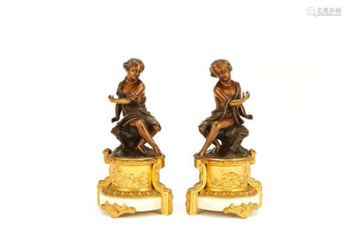 A pair of mid 19th century French patinated bronze figures of a young boy and girl