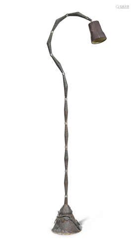 in the manner of Mark Brazier Jones A late 1980's / 90's beaten bronzed metal floor-standing reading lamp