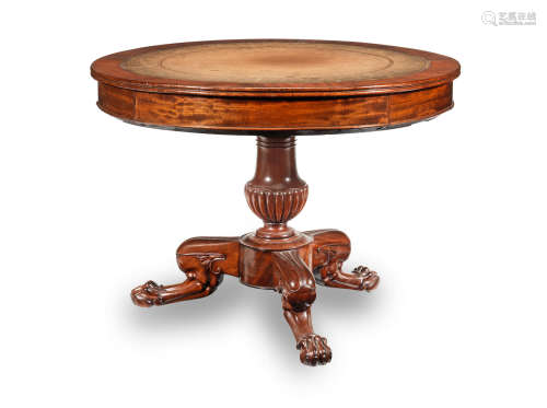 A Charles X mahogany drum top writing table