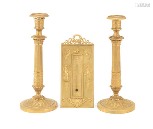 all in the Empire style A pair of late 19th century French gilt bronze candlesticks together with a gilt metal table thermometer and gilt bronze and a gilt bronze stamp box