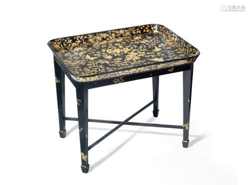 An early 19th century gilt and black japanned papier mache tray by Henry Clay on later stand