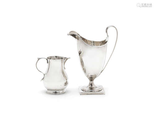 by Thomas Coole II & Richard Gurney, London 1730 together with a George III helmet shaped cream jug, by Henry Chawner, London 1789, height 14cm (2) A George II silver sparrow beak cream jug