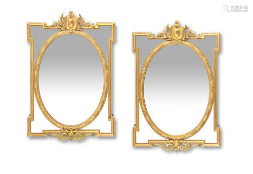 A pair of French late 19th/early 20th century giltwood and gilt composition marginal mirrors