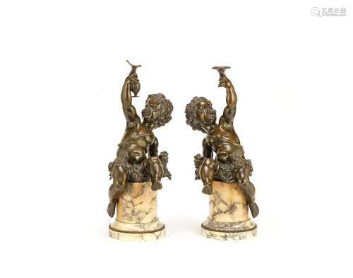 in the manner of Clodion (French, 1738-1814) A pair of late 19th century French patinated bronze figure of young bacchanalian putti