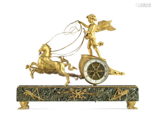 in the Empire style A late 19th century gilt bronze and Verde Antico marble figural mantle clock