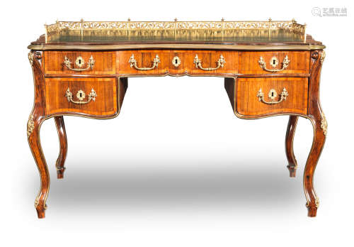 A late 18th/early 19th century gilt brass mounted rosewood and tulipwood crossbanded kneehole desk