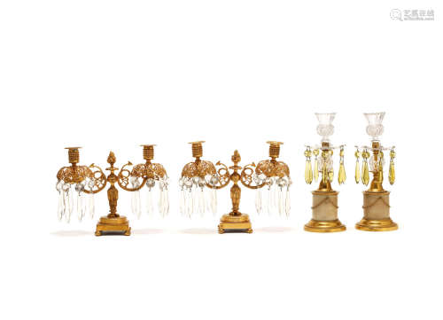 A pair of 19th century gilt bronze and cut glass lustre candelabra together with a pair of later gilt bronze, marble cut glass lustre candlesticks