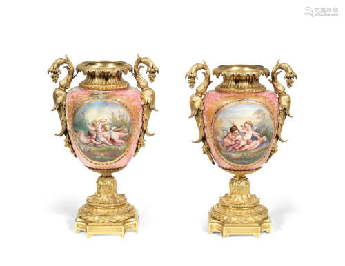 in the Louis XVI style A pair of 19th century French gilt bronze mounted Sevres style porcelain vases