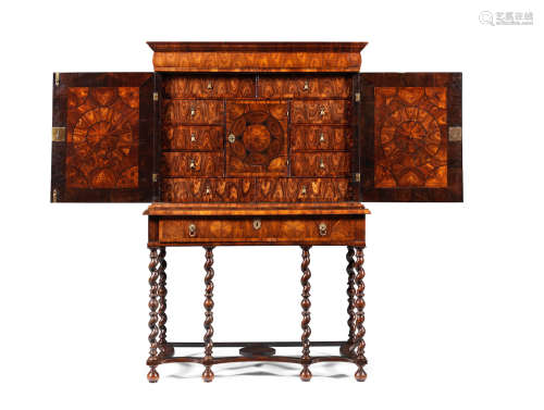 Circa 1690, the cabinet in the manner of Thomas Pistor A William and Mary kingwood, oyster veneered and ebony inlaid cabinet on a later stand