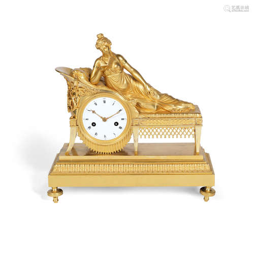 A 19th century French gilt bronze figural mantel clock in the Empire taste