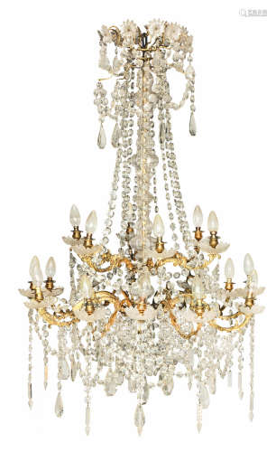 probably French, probably late 19th or early 20th century An Continental gilt bronze and cut and moulded glass eighteen light chandelier