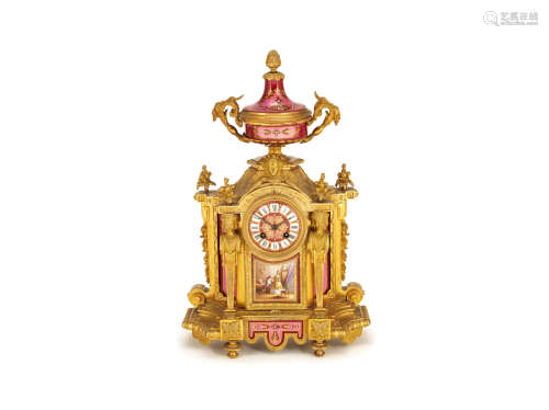 in the Louis XVI style,   A late 19th century French gilt bronze mounted Sevres style pink and claret porcelain mantel clock
