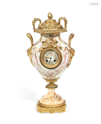 A late 19th / early 20th century Continental gilt bronze mounted porcelain vase mantel clock