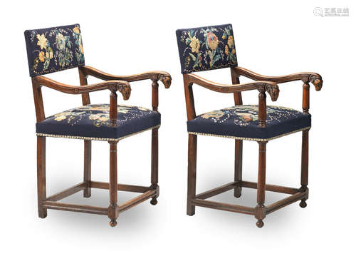 A pair of French carved walnut fauteuils