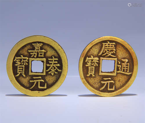 TWO CHINESE GILT BRONZE COINS