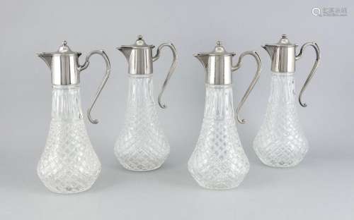 Four carafes, probably England, 20th cent., metal mounting, clear glass, h.