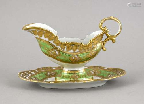 Sauce boat on base, 20th century, curved shape, green ground, gilding, slig