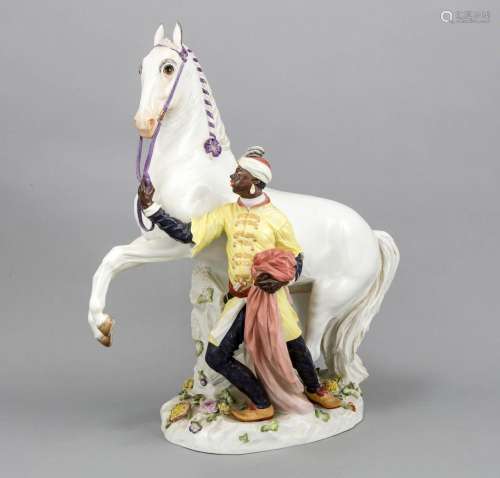 A figure of a blackamoor with white horse, Meissen, mark after 1934, 2nd qu