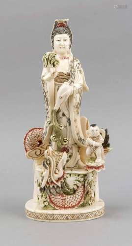 A Chinese Okimono around 1910, ivory, woman on dragon base with child on lo