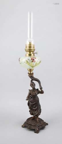 A figural petrol lamp around 1900, patinated metall cast on four feet, tota