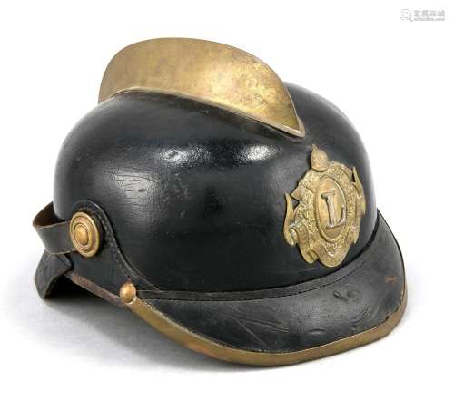 Fire helmet with brass comb, around 1900, lacquered leather with neck prote