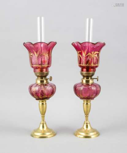 Two French petrol lamps around 1900, brass foot, rosé glass painted with pa