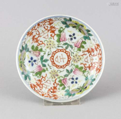 Yi-plate, China, 19th century, flowers and butterflies cluster around the c