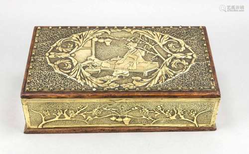 A brass-plate wooden box and cover around 1900, chased with Japanese motifs