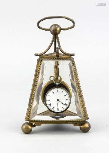 A late 19th-century pocketwatch stand, brass case on ball feet, thick-walle