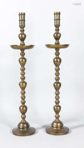 Pair of large candlesticks, 19th century, brass, round base, balustrated sh