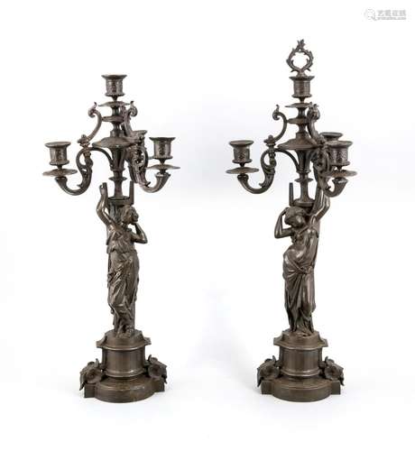 A pair of three-branch candelabra around 1900, metal cast lacquered, one wi