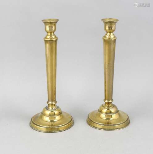 Two brass candlesticks with slightly conical cylinder shaft on circular foo