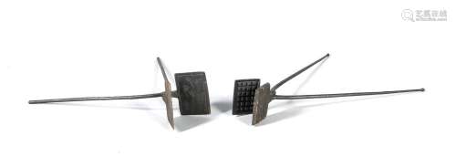 Two waffle irons of the 19th century, blackened iron, one with floral decor