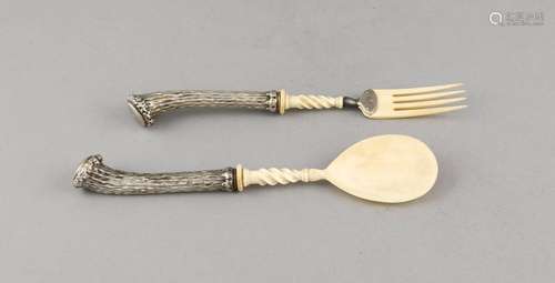 Two pieces serving cutlery, 20th cent., silver tested, handles in the form