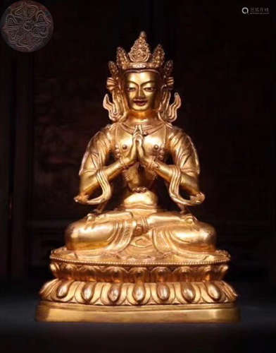 A GILT BRONZE MOLDED BUDDHA STATUE