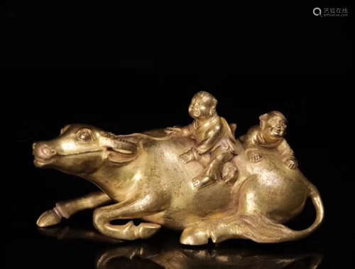 A GILT BRONZE COW AND BOY SHAPED FIGURE