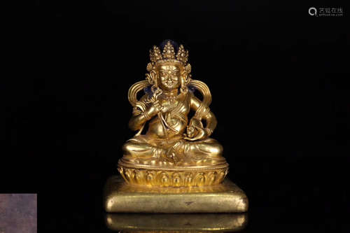 A GILT BRONZE MOLDED BUDDHA STATUE