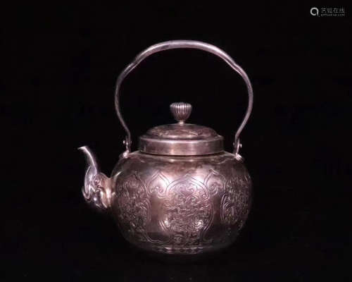 A SILVER MOLDED TEAPOT