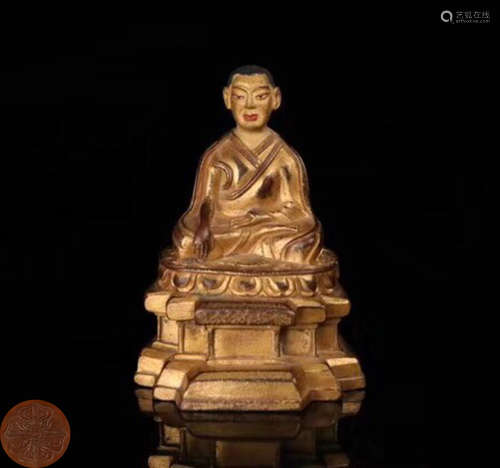 A GILT BRONZE MOLDED BUDDHA STATUE