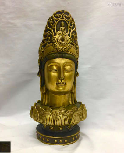 A GILT BRONZE MOLDED GUANYIN HEAD STATUE