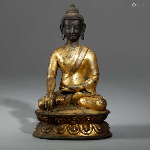 A CHINESE TIBET GILT BRONZE FIGURE OF BUDDHA SHAKY