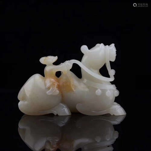 A HETIAN JADE CARVED CAMEL SHAPED PENDANT