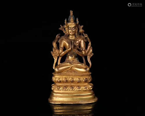 A GILT BRONZE MOLDED GUANYIN STATUE