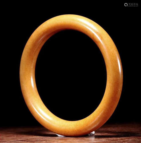 A HETIAN YELLOW JADE CARVED BANGLE