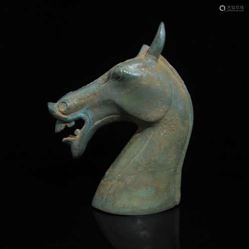 A COPPER HORSE HEAD SHAPED FIGURE