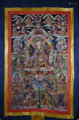 A LARGE TIBETAN EMBROIDERED SILK THANGKA OF PADMASAMBHAVA